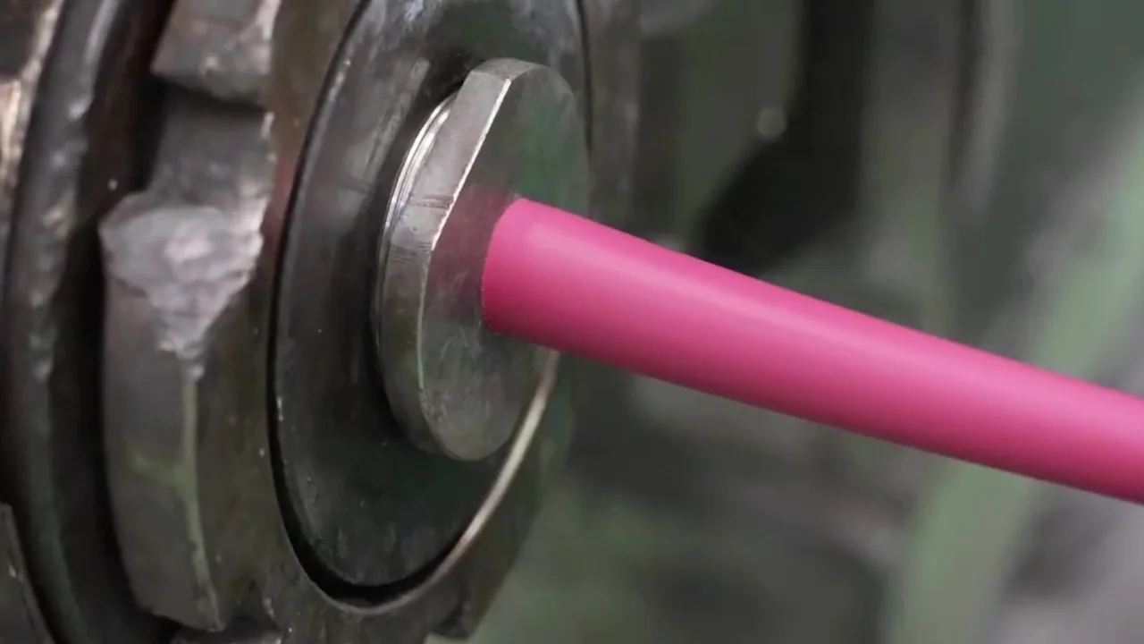 Insulation extrusion — cable core passing through the extruder head