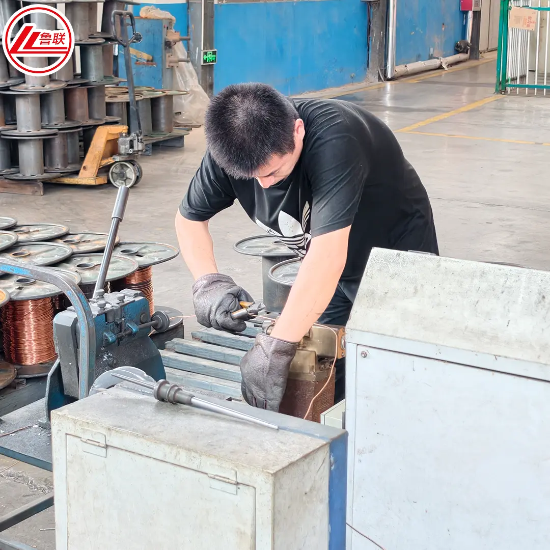 Lulian Cable production operator inspecting manufacturing equipment